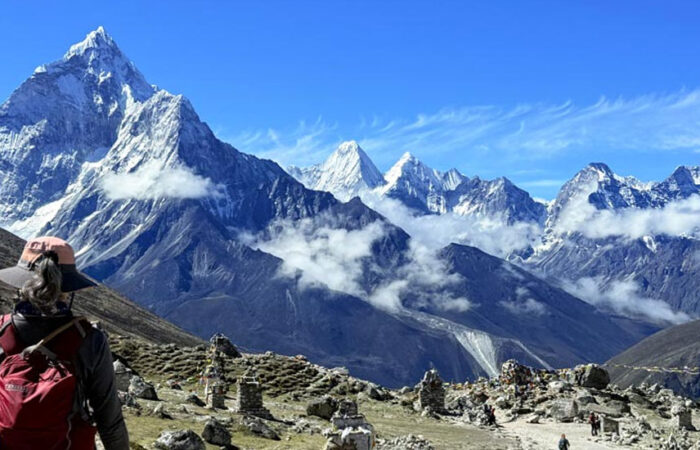 traveler looking at view of himalayan range