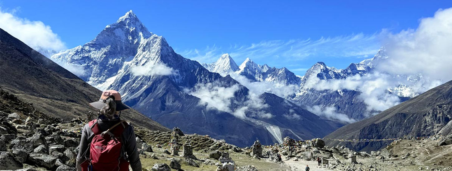 traveler looking at view of himalayan range