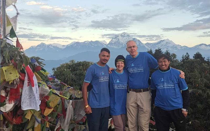 couple enjoying the views of himalayas during poonhill trek